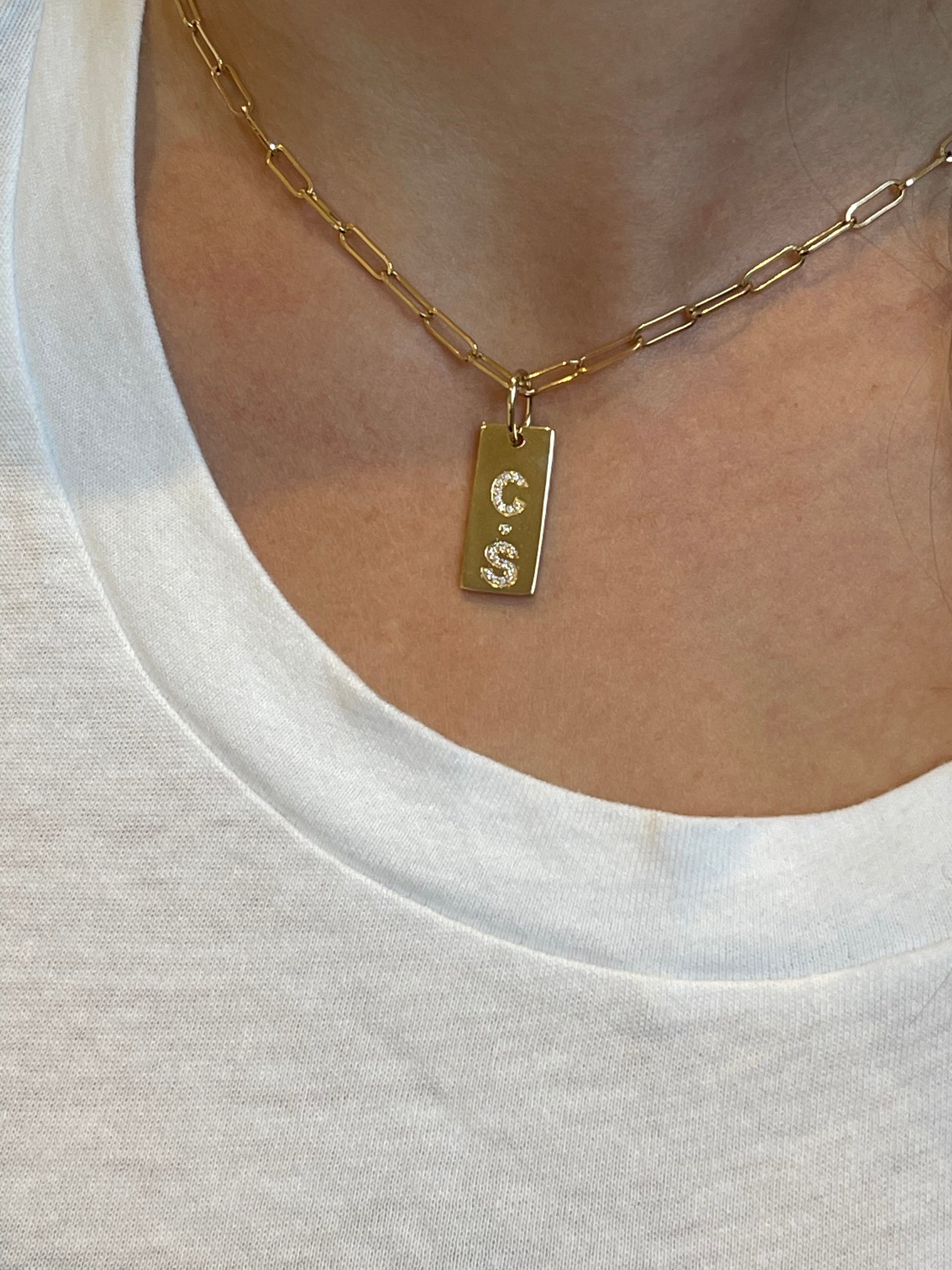 SMALL DIAMOND DOGTAG WITH 2 CHARACTERS PLUS SPACER
14K GOLD AND DIAMOND LONG PERSONALIZED BAR
Diamond Personalized Bars
Personalized Diamond Bar Charm
Custom Diamond Bar Pendant
Diamond Bar with Custom Engraving
Luxury Diamond Personalized Bars
Diamond bar
Personalized charm
Custom pendant
Fine jewelry
Designer necklace
Luxury jewelry
Custom engraving
Statement jewelry
Diamond jewelry
Designer Diamond Personalized Bar
Handcrafted Personalized Diamond Bars
Elegant Diamond Bar Charm for Custom Jewelry